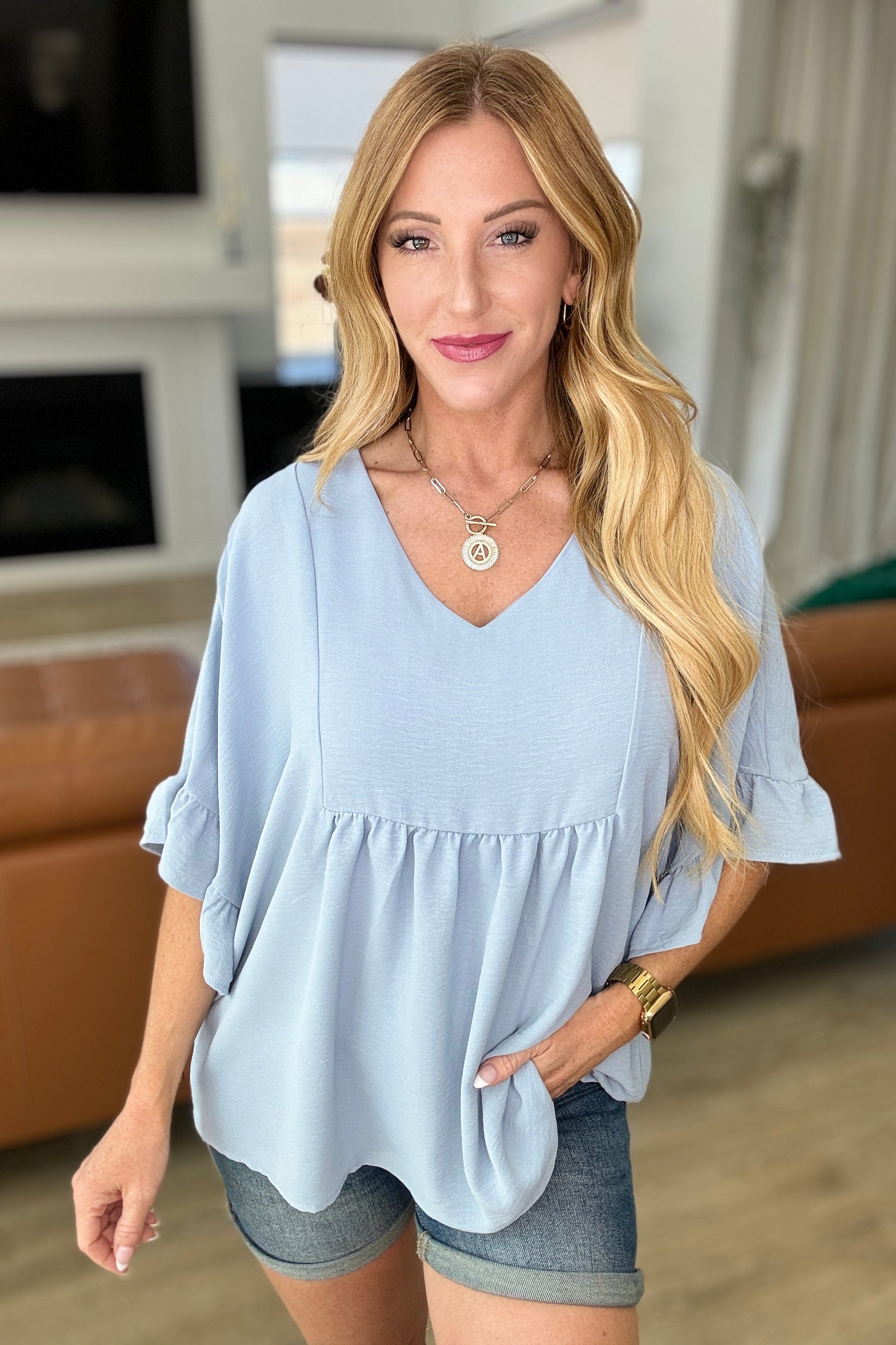 Airflow Peplum Ruffle Sleeve Top in Chambray - Southern Divas Boutique