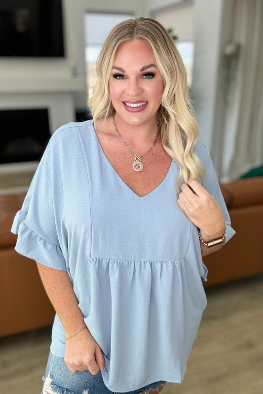 Airflow Peplum Ruffle Sleeve Top in Chambray - Southern Divas Boutique